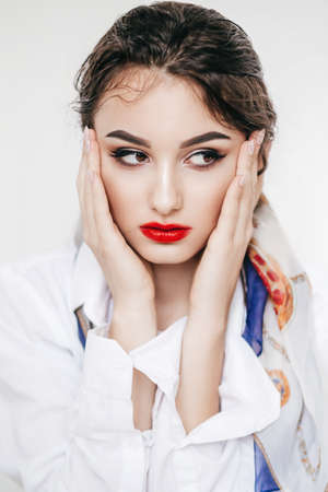 Portrait of beautiful brunette girl with makeup