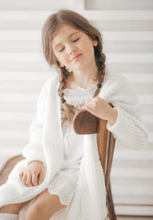Portrait of beautiful little girl with pigtailsの写真素材