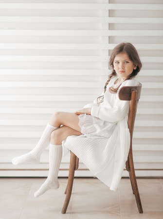 Portrait of beautiful little girl with pigtailsの写真素材