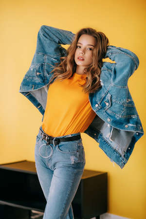 Portrait of beautiful girl with makeup in fashion blue clothesの写真素材