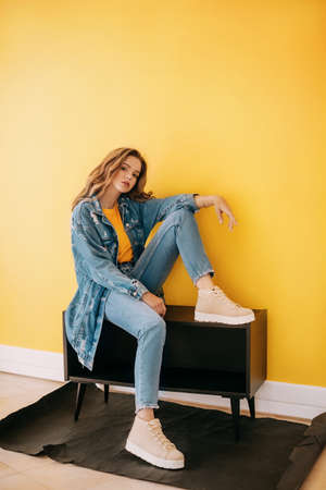 Portrait of beautiful girl with makeup in fashion blue clothesの写真素材