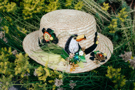 Beautiful straw hat decorated with a broochの写真素材