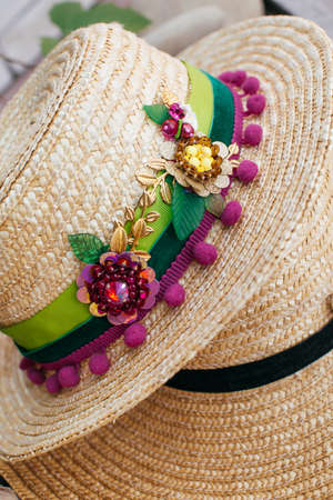 Beautiful straw hat decorated with a broochの写真素材