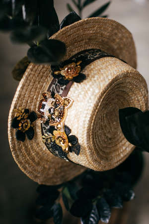 Beautiful straw hat decorated with a broochの写真素材
