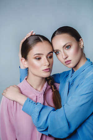 Beautiful portrait of two sistersの写真素材