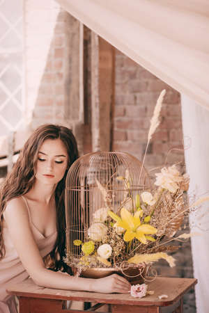 Portrait of beautiful girl in flower gazeboの写真素材