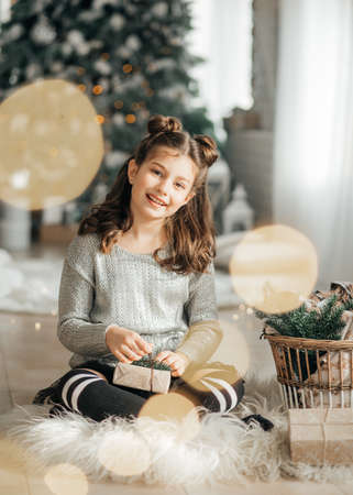 Happy little girl in Christmas decorationsの写真素材