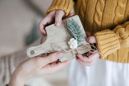 Stock Photo - Beautiful little girl with wooden christmas decorの写真素材