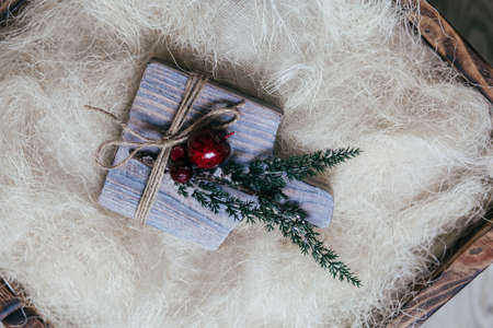 Stock Photo - Christmas wooden board with snow fir tree and decor