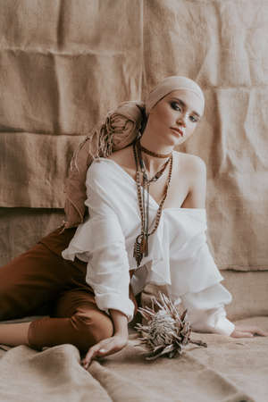 Stock Photo - Beautiful fashion model posing in boho style clothesの写真素材