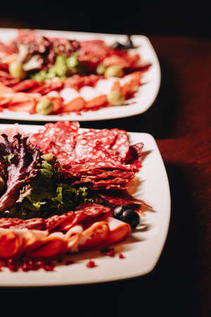 Stock Photo - Meat plate: sausage, bacon, savory appetizers and saucesの写真素材