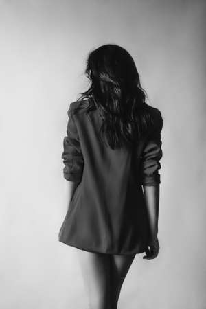 Portrait of beautiful young woman with makeup in fashion clothes. Black and white photoの写真素材