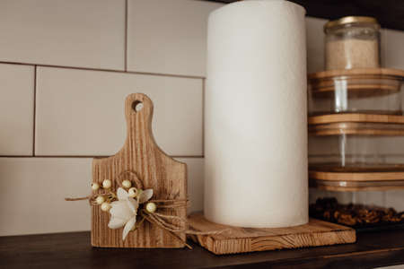 A cute rustic wooden toy in the kitchen. Kitchenware. Cozy way to rest, home comfort concept.