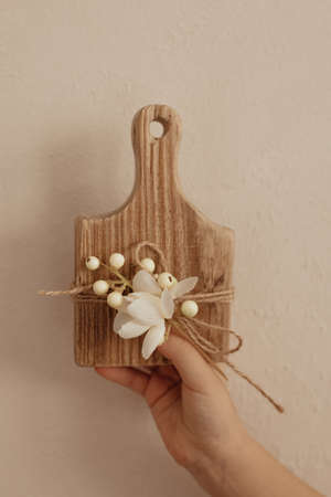 A cute rustic wooden toy in the kitchen. Kitchenware. Cozy way to rest, home comfort concept.
