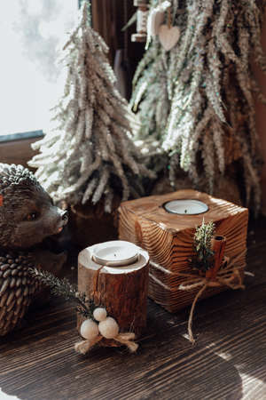 Christmas Rustic wooden candlestick. Cozy way to rest, home comfort breakfast concept.の写真素材
