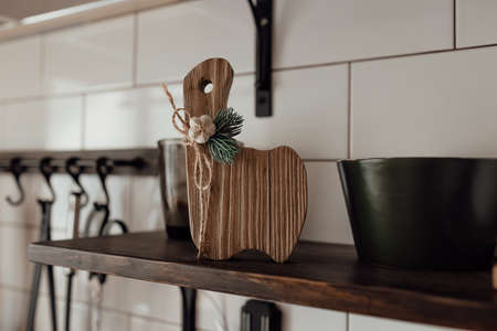 A cute rustic wooden kitchenware in the kitchen. Cozy way to rest, home comfort concept.の写真素材
