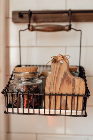 A cute rustic wooden kitchenware in the kitchen. Cozy way to rest, home comfort concept.