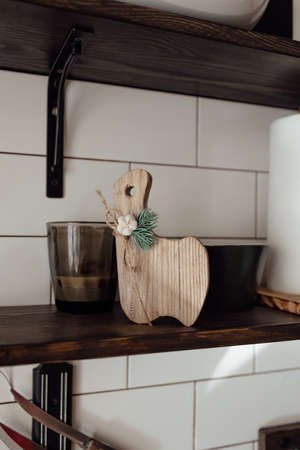 A cute rustic wooden kitchenware in the kitchen. Cozy way to rest, home comfort concept.の写真素材