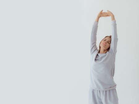 Ukrainian  young  woman in sweatshirt mock up on light background. Female body and style concept. Advertisement or clothes sale design. Mock up for design, clothes shop sale.の写真素材