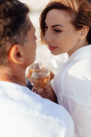 Happy romantic middle aged couple are by the sea. Lifestyle Concept. Closeup photo.の写真素材