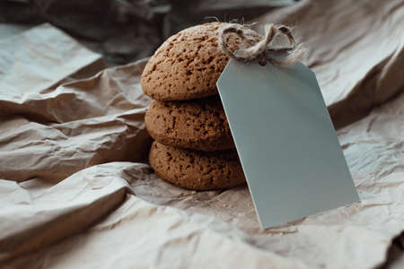 Bakery products with card for logo. Homemade cookies with sugar on a paper background. Background image, copy space.の写真素材