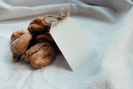 Bakery products with card for logo. Homemade cookies with sugar on a paper background. Background image, copy space.の写真素材