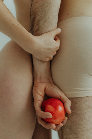 Cheerful hands on white background, isolated. Concept of natural beauty and feeling comfortable. Body positive young couple.の写真素材