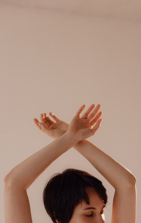 Sporty young woman doing yoga practice on white background. Concept of healthy life and natural balance between body and mental development.の写真素材