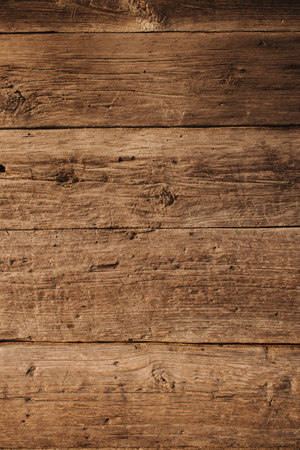 Dark wood texture background with natural pattern, wooden table top view. Empty arboreal background.