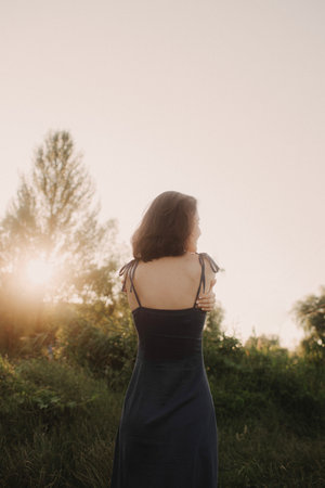Overjoyed happy woman enjoying the green beautiful nature around her - concept of female people and healthy natural lifestyle. Part of the series.の写真素材