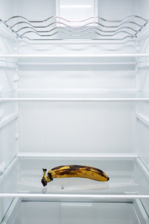 Moldy spoiled banana in the refrigerator. Improper storage, spoiled product, expired concept. Part of a series.の写真素材