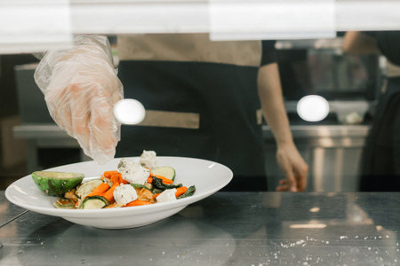 Modern restaurant with different ingredients for creating a dish in metal warm containers on the counter. Catering and buffet concept.の写真素材