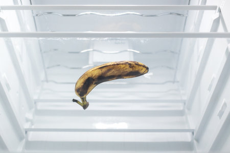 Moldy spoiled banana in the refrigerator. Improper storage, spoiled product, expired concept. Part of a series.の写真素材