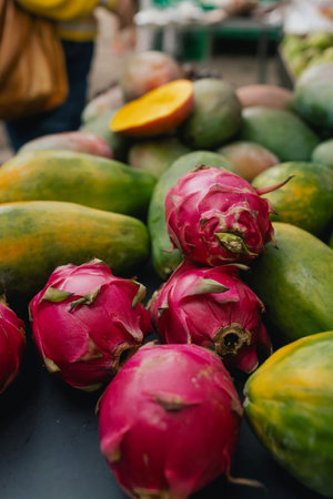 Fresh dragon fruit at small local urban market. Organic produce on sale at outdoor farmer market. Selling fresh crops and veggies harvest. European urban setting. Close up. Part of the series.の写真素材