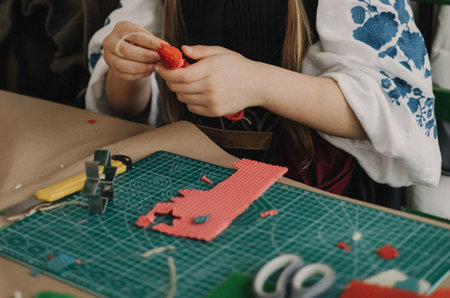 Close-up of hands making a candle from beeswax. Master class on creating a candle. DIY. Part of the series. Soft focusの写真素材