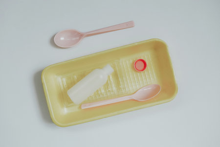 Plastic waste on a light background. Concept of waste minimization, plastic recycling industry and...