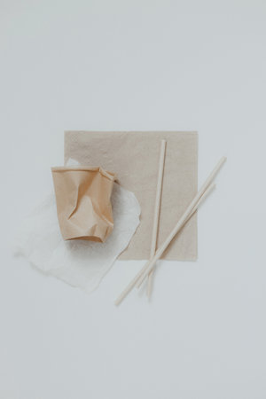 Eco friendly, disposable, recyclable, compostable tableware. Paper food boxes, dishes on light background. Sustainable lifestyle and PLASTIC FREE concept. Flat lay Earth tones with place for textの写真素材