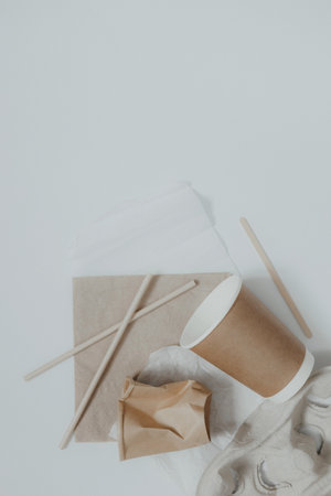 Eco friendly, disposable, recyclable, compostable tableware. Paper food boxes, dishes on light background. Sustainable lifestyle and PLASTIC FREE concept. Flat lay Earth tones with place for textの写真素材