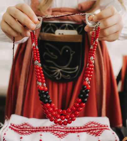 Part of Ukrainian traditional national costume closeup: embroidered shirt, vyshyvanka, skirt, woven...