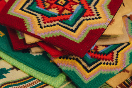 Fragment of antique handmade carpet, Crafts. Woven wool carpet. Folk art. Close up of geometric...