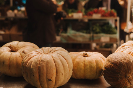 Freshly pumpkins grouped together in a tight frame, showcasing their vibrant color. Shopping At Farmers Market Stall. Close up. Part of the seriesの写真素材