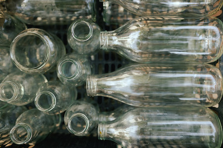 Empty Glass Bottles for Recycling. European urban setting. Close up. Part of the series.の写真素材