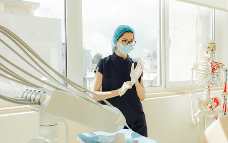 Woman in medicine, young dentist professional, teeth and dentist for dental care, appointment or checkup at clinic. Tooth whitening, cleaning or oral, mouth and gum care. Part of a series. Close-upの写真素材