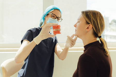 Middle-aged woman, teeth and dentist for dental care, appointment or checkup at clinic. Tooth...