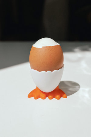 Boiled egg on a stand ready to eat. Side viewの写真素材
