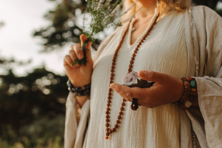 Close-up of female hands holding natural healing stones. Tools for energy balance, emotional support, self-discovery through intention, intuition, gentle presence. Vintage tone. Soft focus, blurred.の写真素材