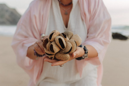 Close-up of female hands holding sound healing instruments. Tools for therapy, inner balance, and self-discovery through vibration, intention, and deep presence. Vintage tone. Soft focus, blurred.の写真素材