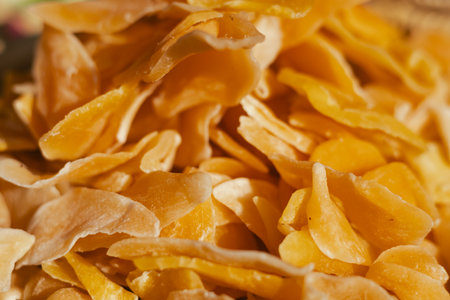 Dried fruit on sale at outdoor farmer market. The fruit shrinks during this process, leaving a...