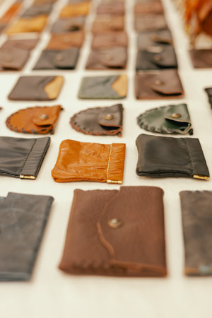 Leather purses on flea market in Lisbon. Garage sale, reuse the clothes, second hand and eco consumer.の写真素材