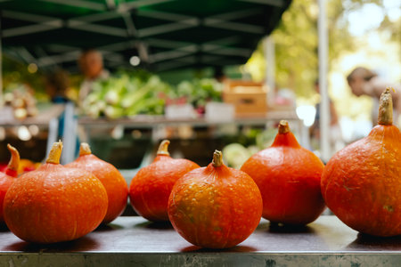 Fresh vegetables at small local urban market. Organic produce on sale at outdoor farmer market....
